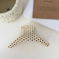 The Spotted Hair Claw